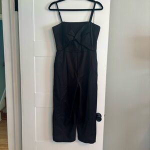 Trina Turk Black Jumpsuit spaghetti straps, pockets, twist front, wide leg capri